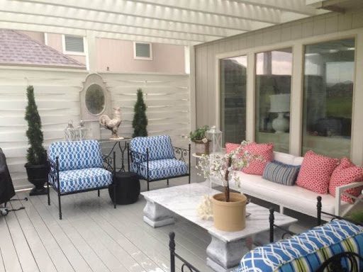 Deck with white woven privacy wall